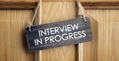 Interview in progress sign on office door