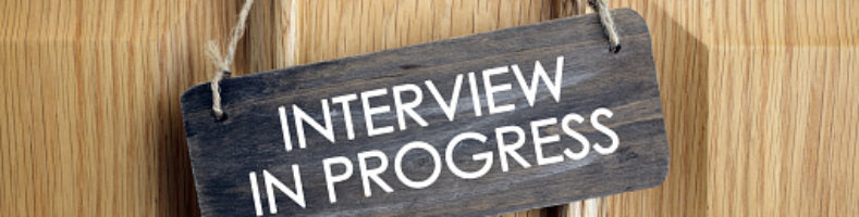 Interview in progress sign on office door